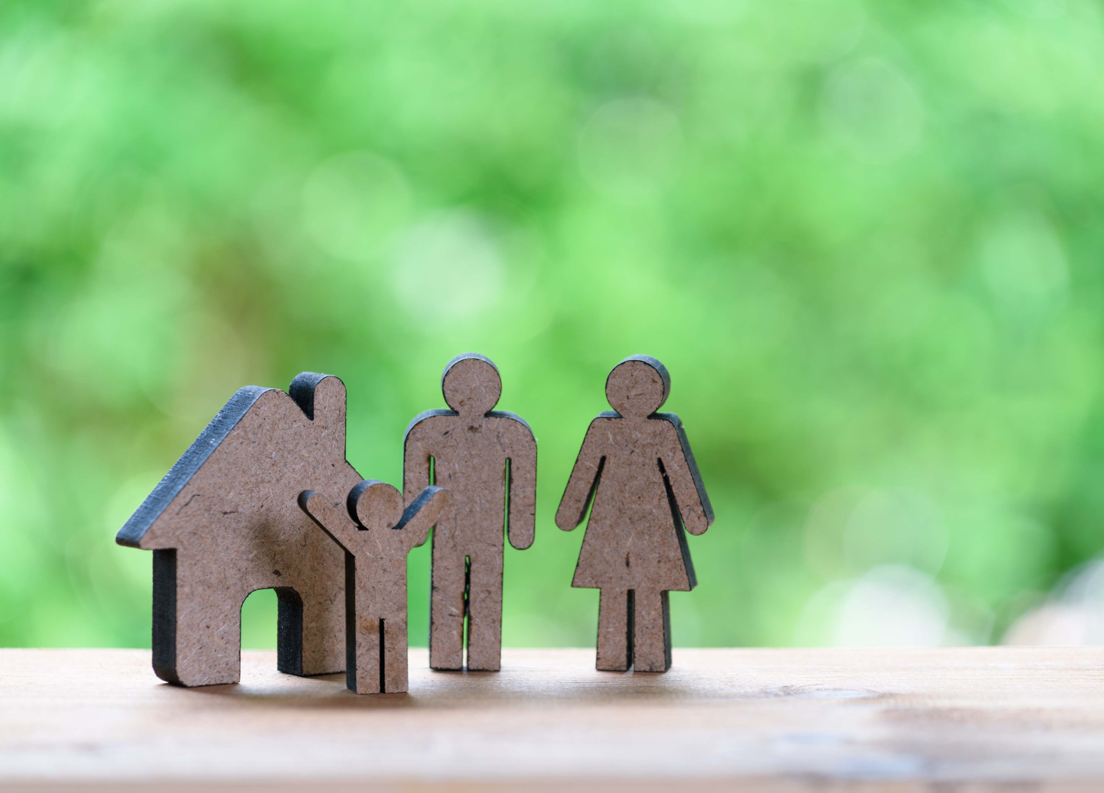 happy family concept father mother kid wood model with green nature